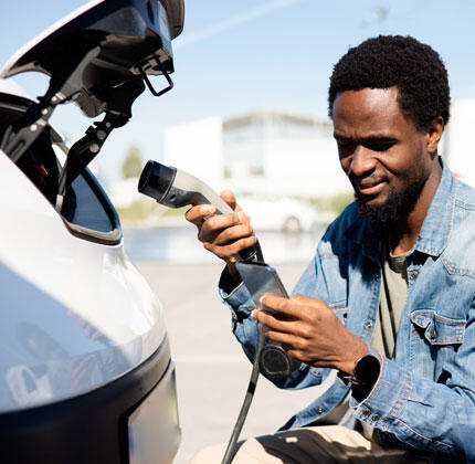 Man-Charging-EV-Truck