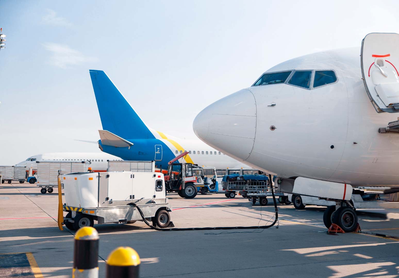 airplane hooked up to a fueling station