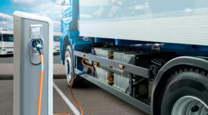 electric commercial truck attached to a charging station