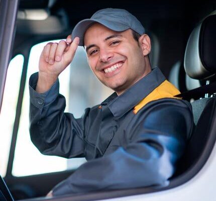 bus driver smiling and tipping hat